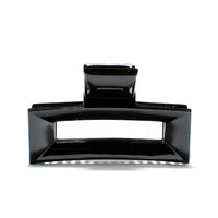Frame 9 claw clip in Piano Black — architectural jet-black cellulose acetate hair clip, made in France
