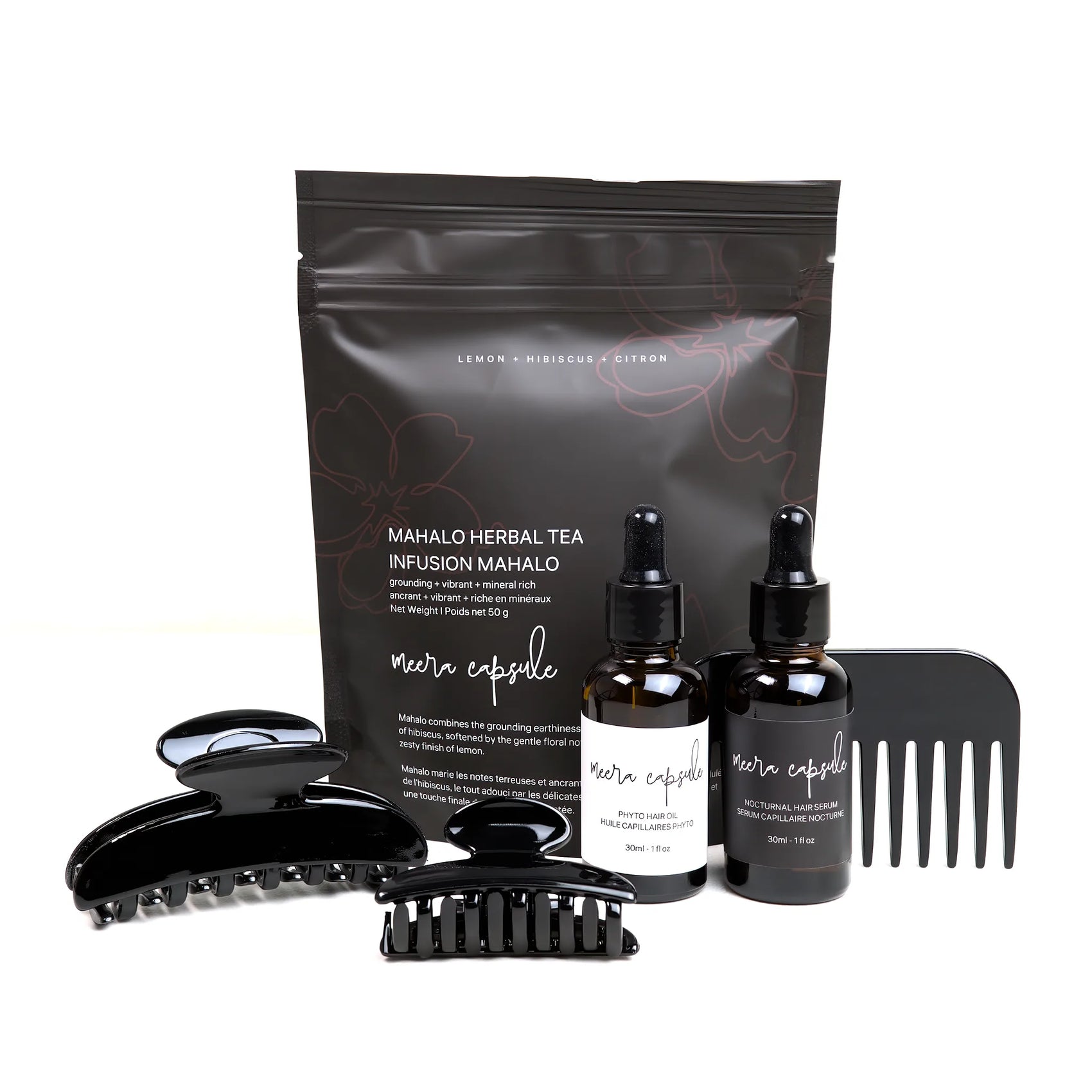 Luna Nourish Capsule in Piano Black — Meera evening ritual bundle with Luna jet-black clip, Phyto Oil, Nocturnal Serum, and Mahalo Tea
