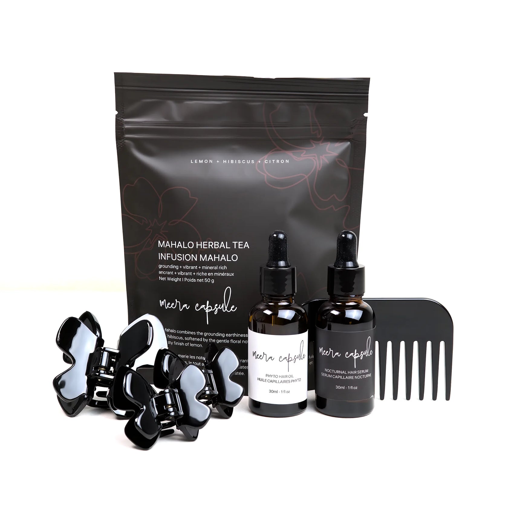 Phoebe Nourish Capsule in Piano Black — Meera evening ritual bundle with Phoebe jet-black clip, Phyto Oil, Nocturnal Serum, and Mahalo Tea