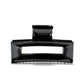 Frame 9 claw clip in Piano Black — architectural jet-black cellulose acetate hair clip, made in France