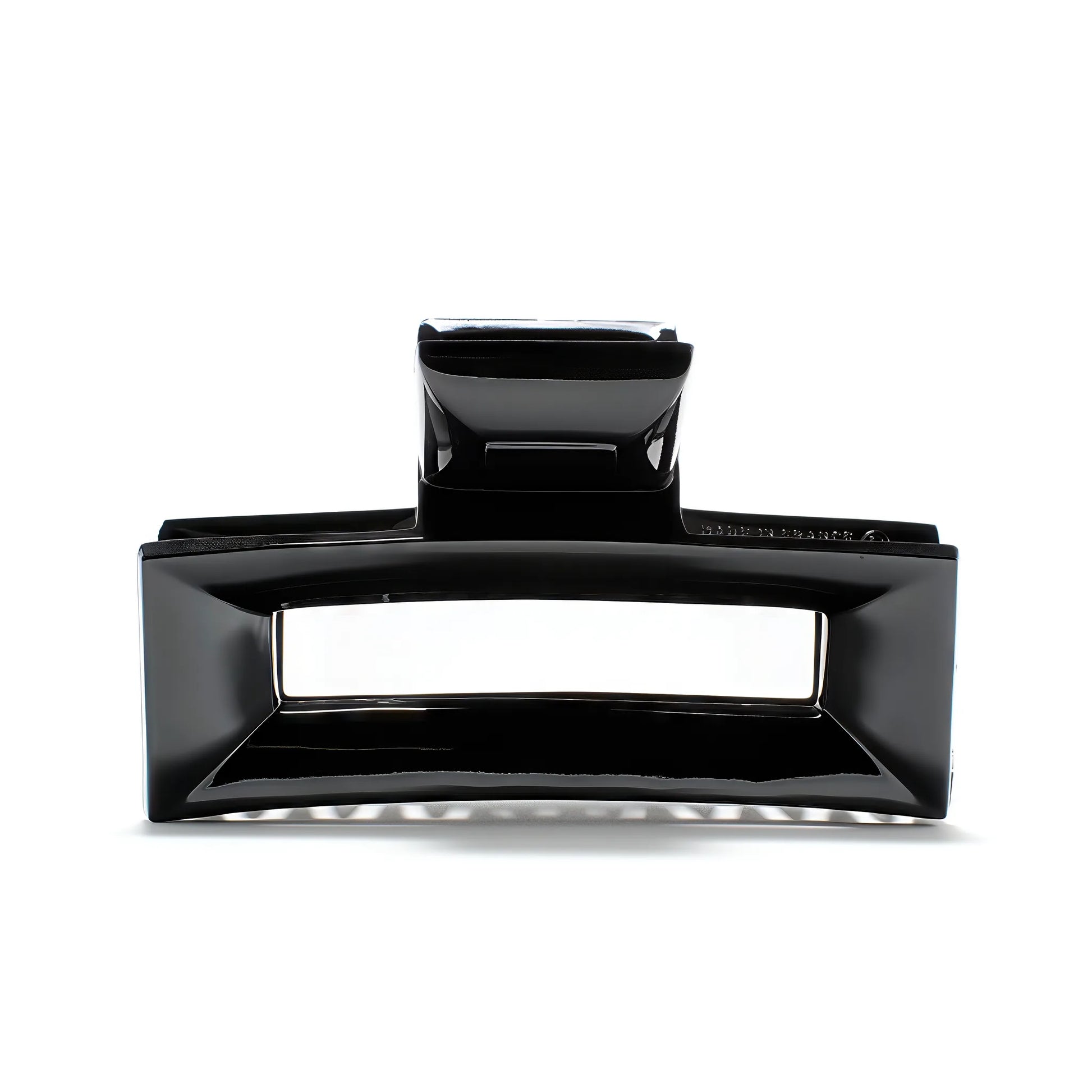 Frame 9 claw clip in Piano Black — architectural jet-black cellulose acetate hair clip, made in France