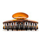 Luna 9 Deep Amber claw clip detail — Meera Studio Line, rounded tortoise silhouette