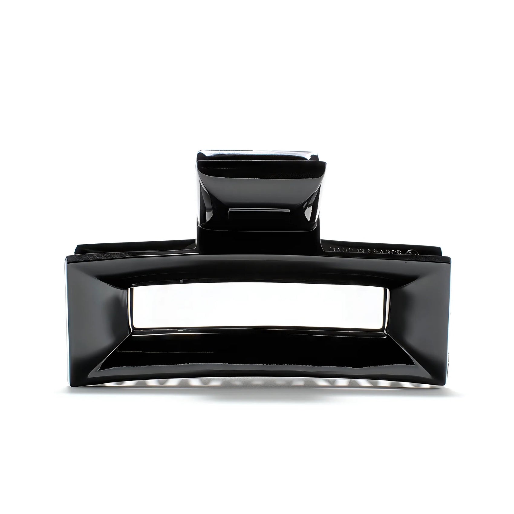 Frame 9 claw clip in Piano Black — architectural jet-black cellulose acetate hair clip, made in France