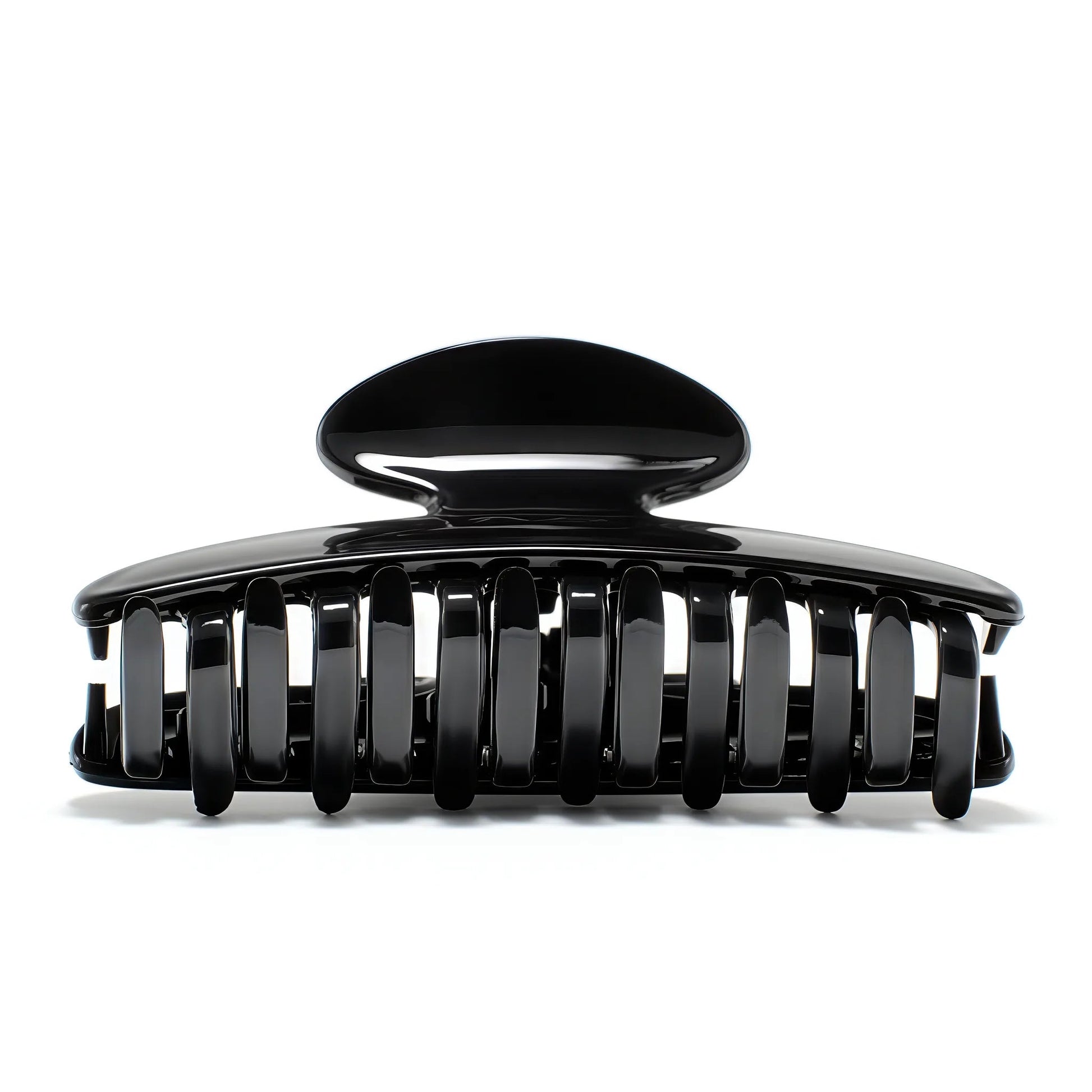 Luna 9 Piano Black claw clip detail — Meera Studio Line, polished black silhouette